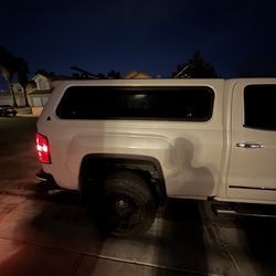 Pearl white LEER Camper with racks