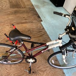 Women’s 10 speed bicycle and bike rack. 
