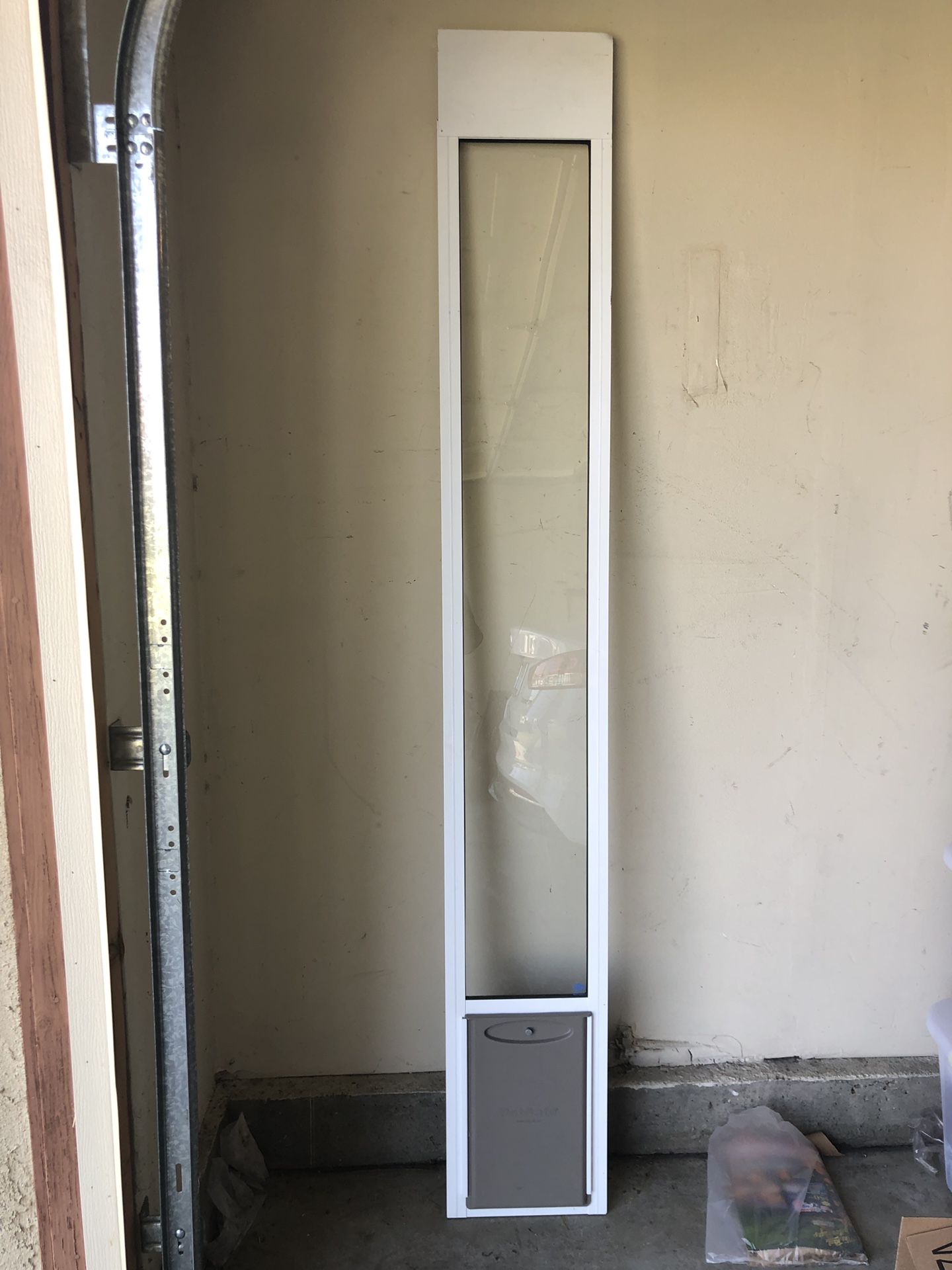 Like new small doggy door for sliding glass door. Used once