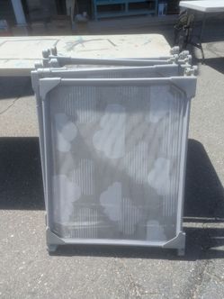 grey Skip Hop Playview Expandable Enclosure featuring cloud-patterned mesh panels.
