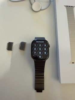 Apple Watch Series 11, 46mm natural titanium case, GPS + Cellular, with the titanium Link band.