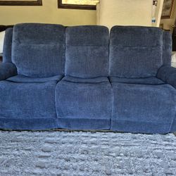 New fabric power reclining-power headrest sofa in excellent cosmetic and working condition  I can help deliver 