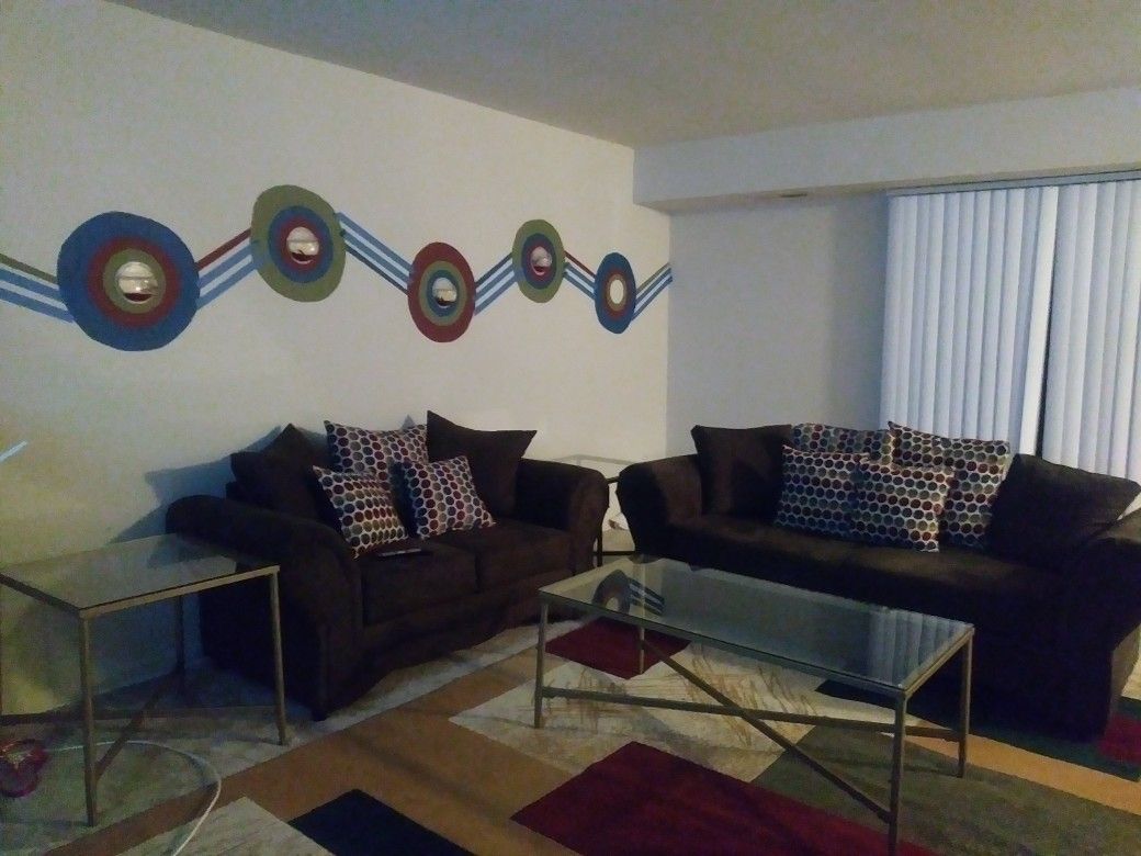 2 couchs, 1 coffee table, 2 end tables and rug