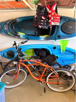 Two ten foot kayaks, 1 beach cruiser and mountain bike