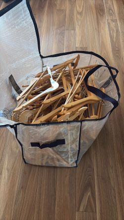 Bag of wooden hangers in mint condition