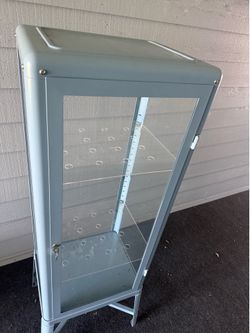 Blue ikea fabrikor cabinet with custom shelves