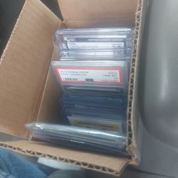 box of holos and ex pokemon and three slabs 