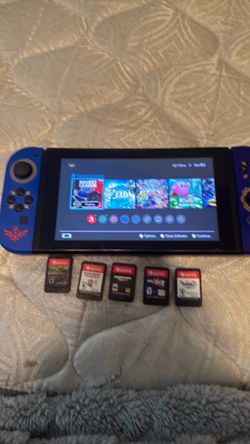 Nintendo Switches and a dock and games