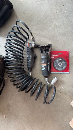 Husky pneumatic setup including an air hose, a Husky angle die grinder, a Husky 3-inch cut-off tool, and a pack of Husky cut-off discs.