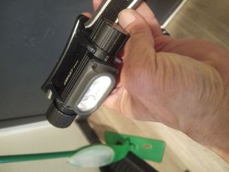 Coast brand head lamp.