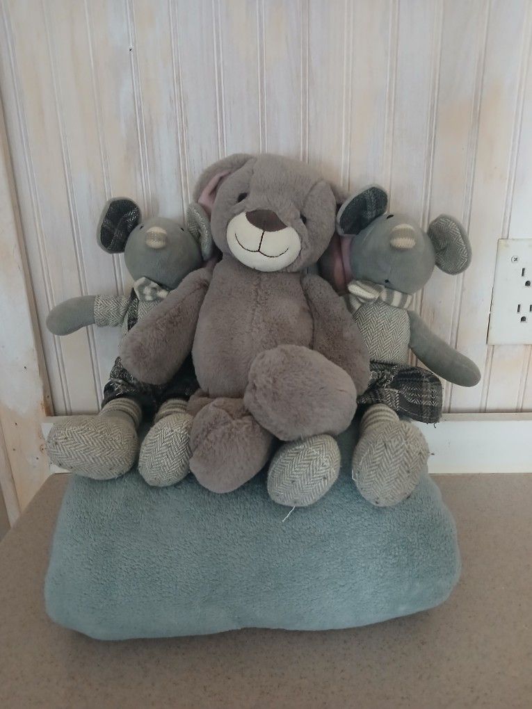 Stuffed animals and blanket