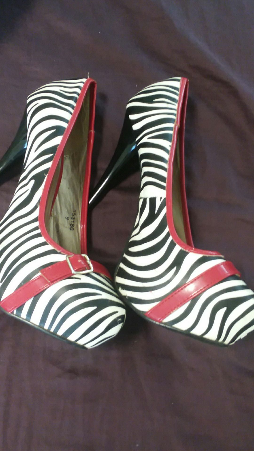 Zebra print with Red trim Heels Size 9 brand name Qupid