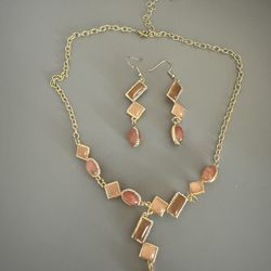 Women’s pink and golden jewelry set
