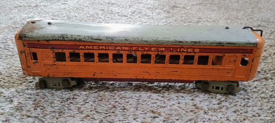 vintage prewar American Flyer O gauge streamlined passenger car, specifically styled after the famous Hiawatha train of the mid-1930s, featuring orang