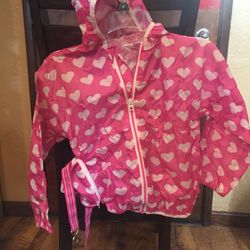 Girls Size 6 - Pink with hearts windbreaker that turns into pouch to wear around your waist. By Hatley