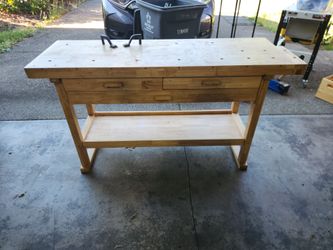 Woodworking bench with drawers and vice