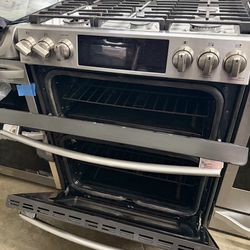 GE slide in gas range double oven excellent condition