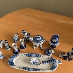 Blue And White Figurines And Small Candle Holders
