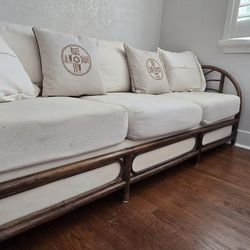 Beige couch w/ wood frame