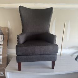 Modern Wingback Accent Chair with nailhead trim.