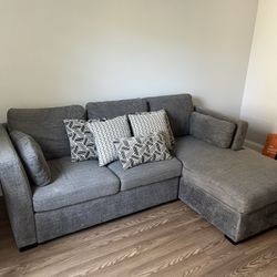 BARELY USED PULL OUT COUCH WITH STORSGE