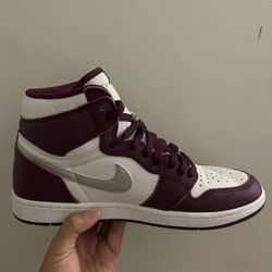 Burgundy and white Jordan 1 trainers
