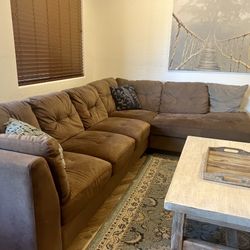 Sectional button couch, Coffee table, Rug and pillows 