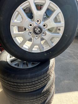 Toyota set of 4 wheels and new tires