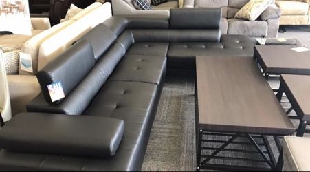 Black leather sectional with adjustable headrests