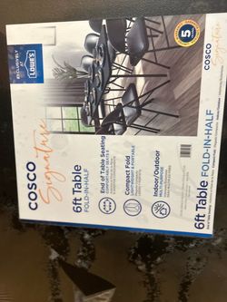 brand new in plastic Cosco signature 6FT Fold-in-Half Table brand new in plastic