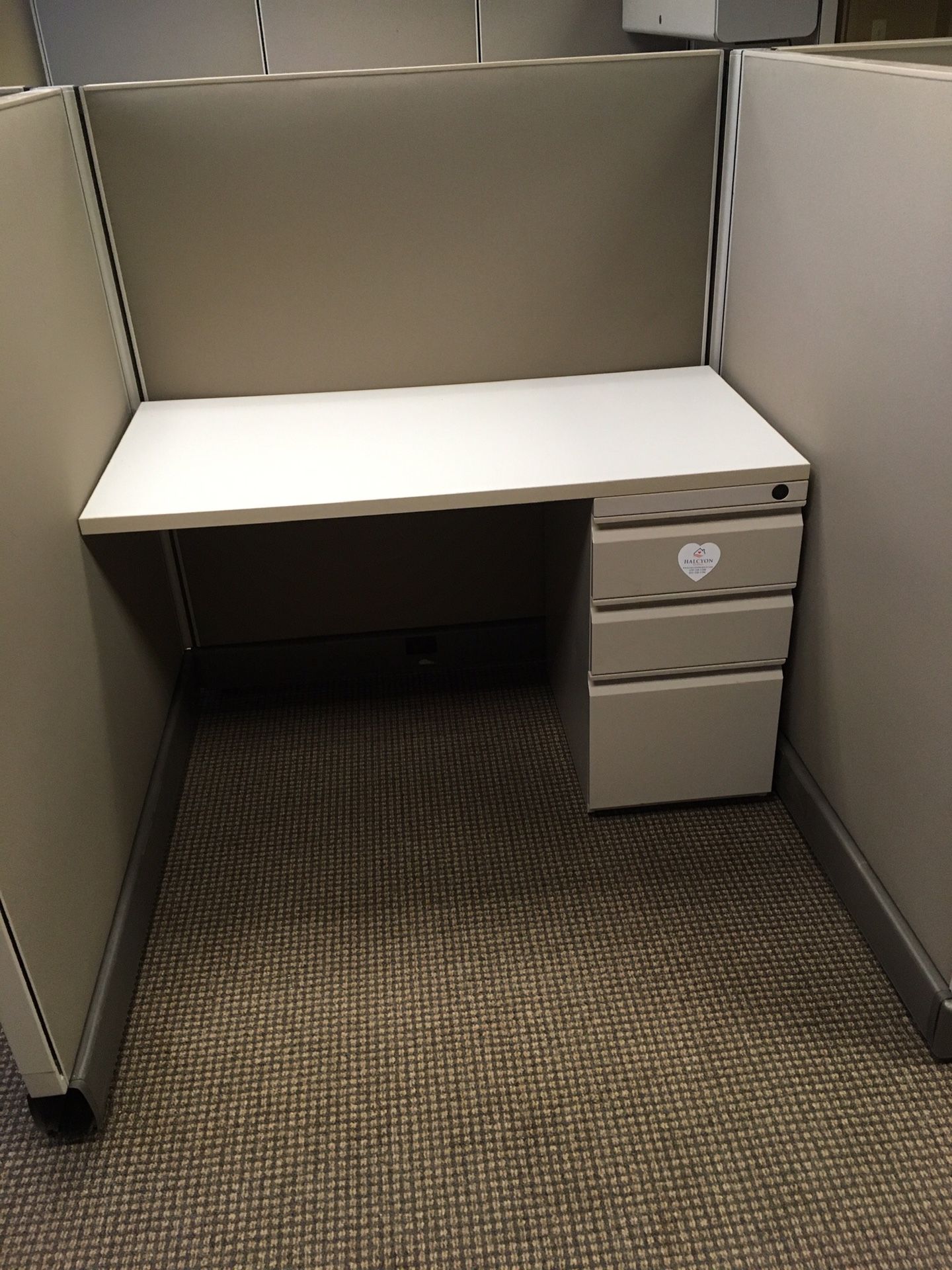 3 section cubicle unit. 1 section has full setup of file cabinet/desk.