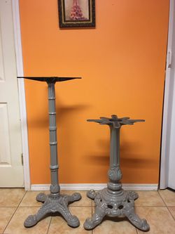 Have 2 cast iron decorative table bases no tops taller is 41" lower is29" would sell separate small $50 taller$60