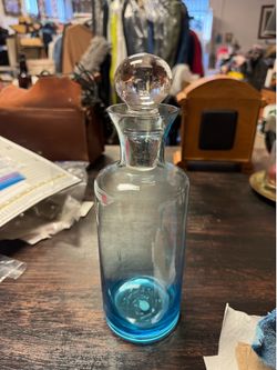 Blue Festival decanter with topper  features a vibrant blue gradient glass design with a clear spherical stopper.