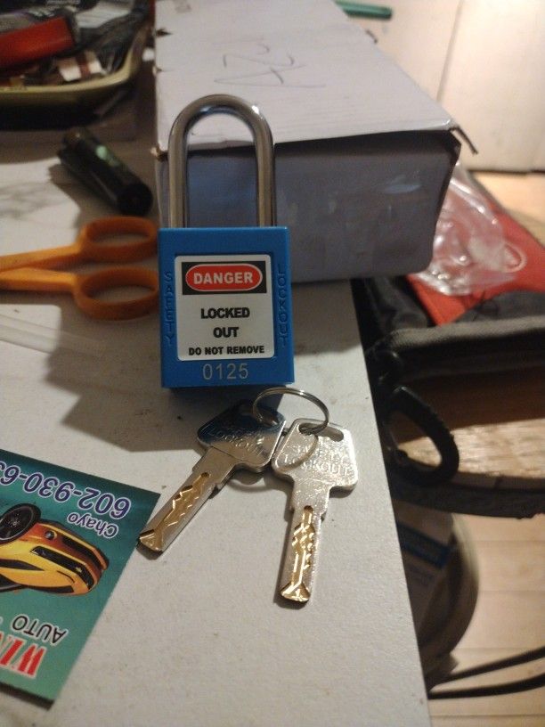 Metal Padlock With Two Keys And A Plastic Cover
