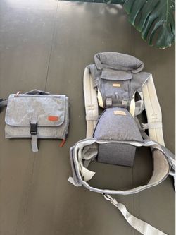 Brand new baby sling and baby changing station.