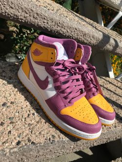 Purple and yellow Nikes