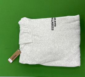 A Fear of God Essentials unisex hoodie in a size medium