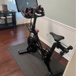 Peloton Bike; 2 Pairs Of Shoes; Mat; Water Bottle