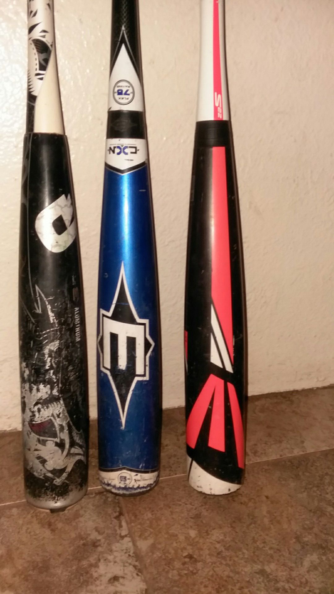 Demarini and two Easton baseball bats