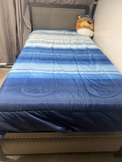 Gray Upholstered Twin Bed Frame with Nailhead Trim