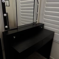 black vanity with hollywood style lights 