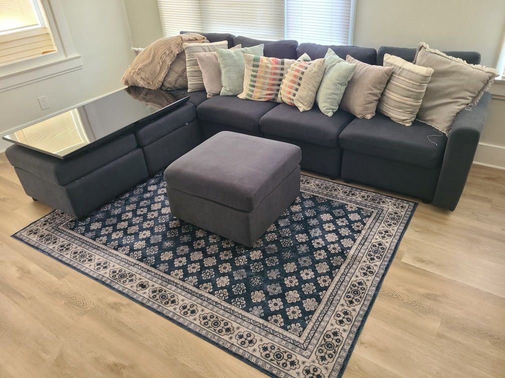 Sectional Couch ($750) + Rug ($25) Pillows Included