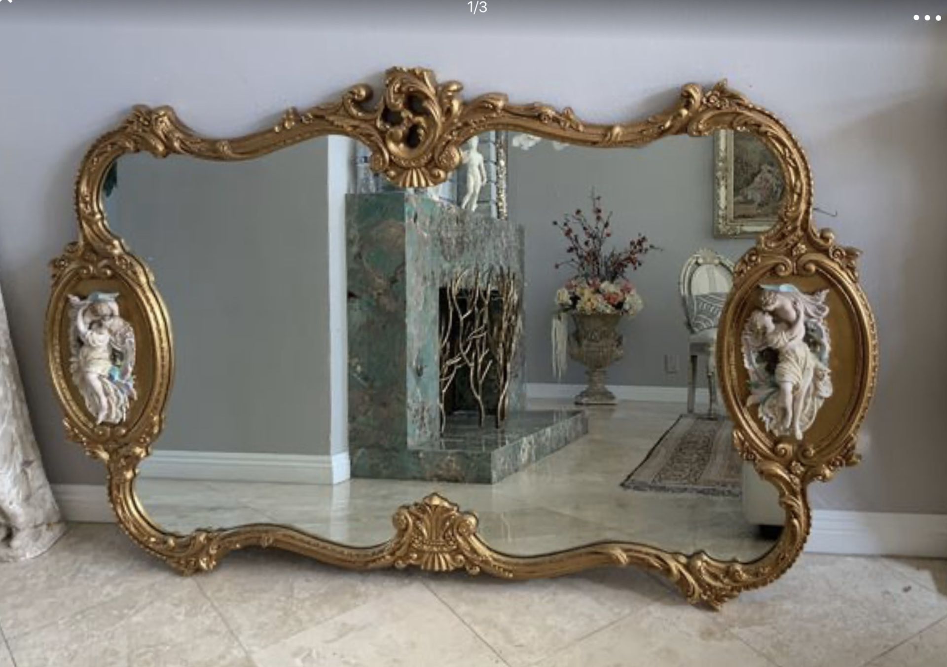 73”x46” Absolutely breathtaking antique Italian Rococo gold gilded mirror adorned on each side with the realistic figures-from two young lover.