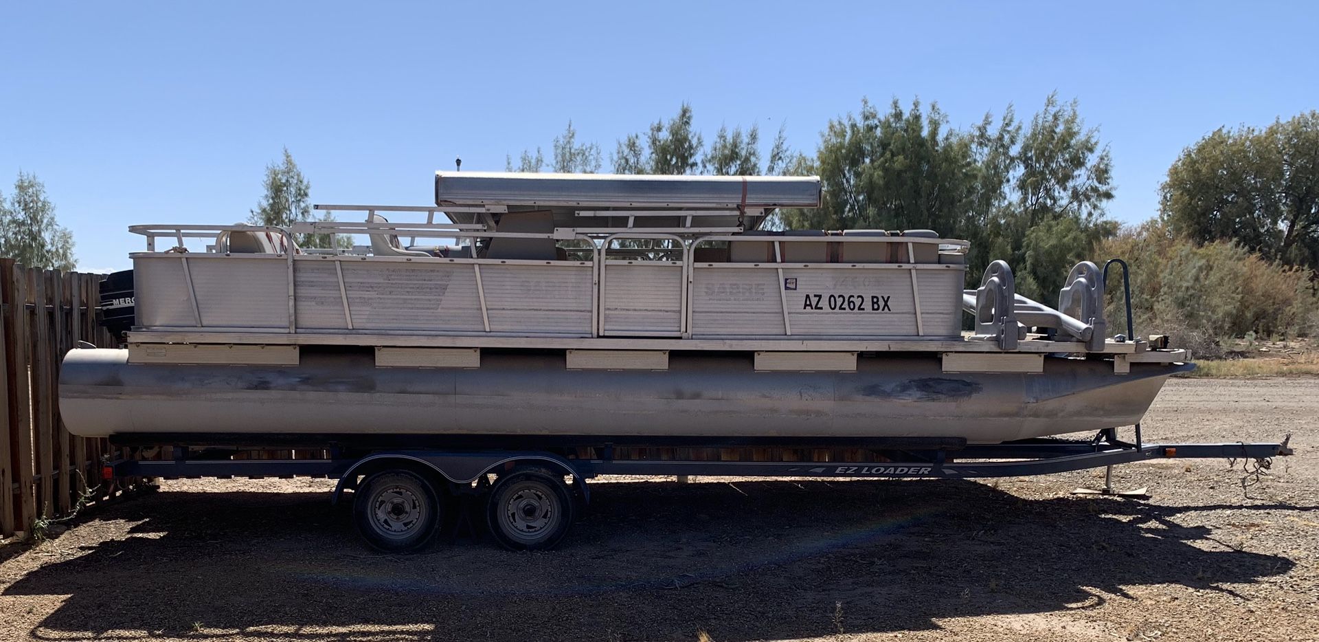 25ft pontoon boat Aluminum shade Needs upholstery and TLC Been sitting awhile Too much boat for owner Good motor 45hp Mercury in Ehrenberg, AZk