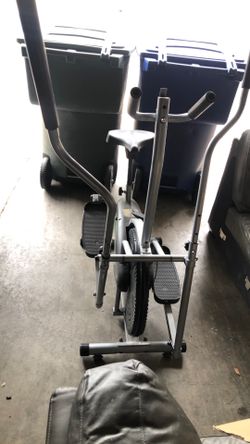 Compact silver and black Elliptical trainer