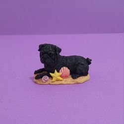 Danbury Mint Pug Dog Miniature Figure Collection, Resting on sand with starfish.
