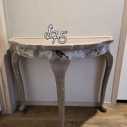 Table is hand painted.