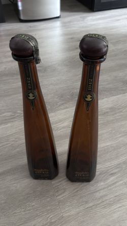 Lot of 2 authentic Don Julio 1942 Añejo bottles — 750ml, empty.