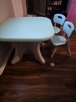 Kids table and 2 chairs with storage bins