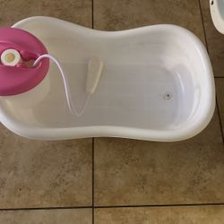 bathtub with shower head